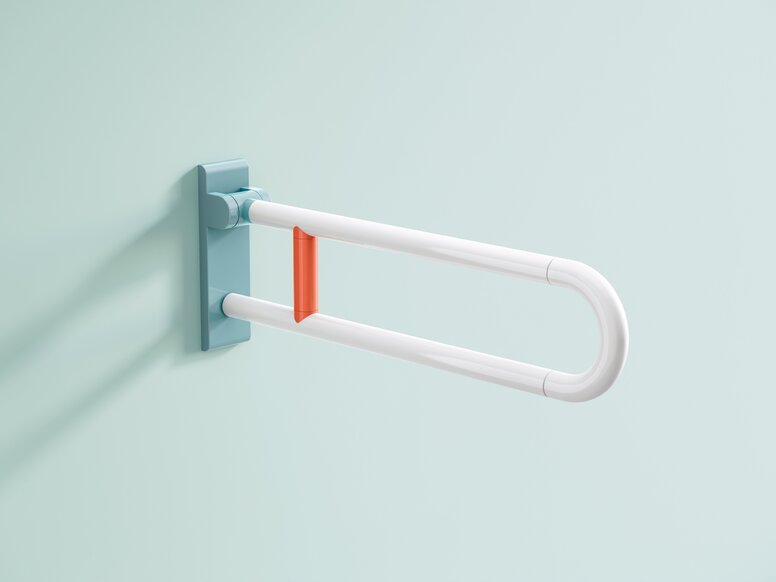 HEWI Range 801 ICONIC hinged support rail Hinged synthetic material support handle with a blue wall bracket and an orange support bar positioned centrally on a light blue wall